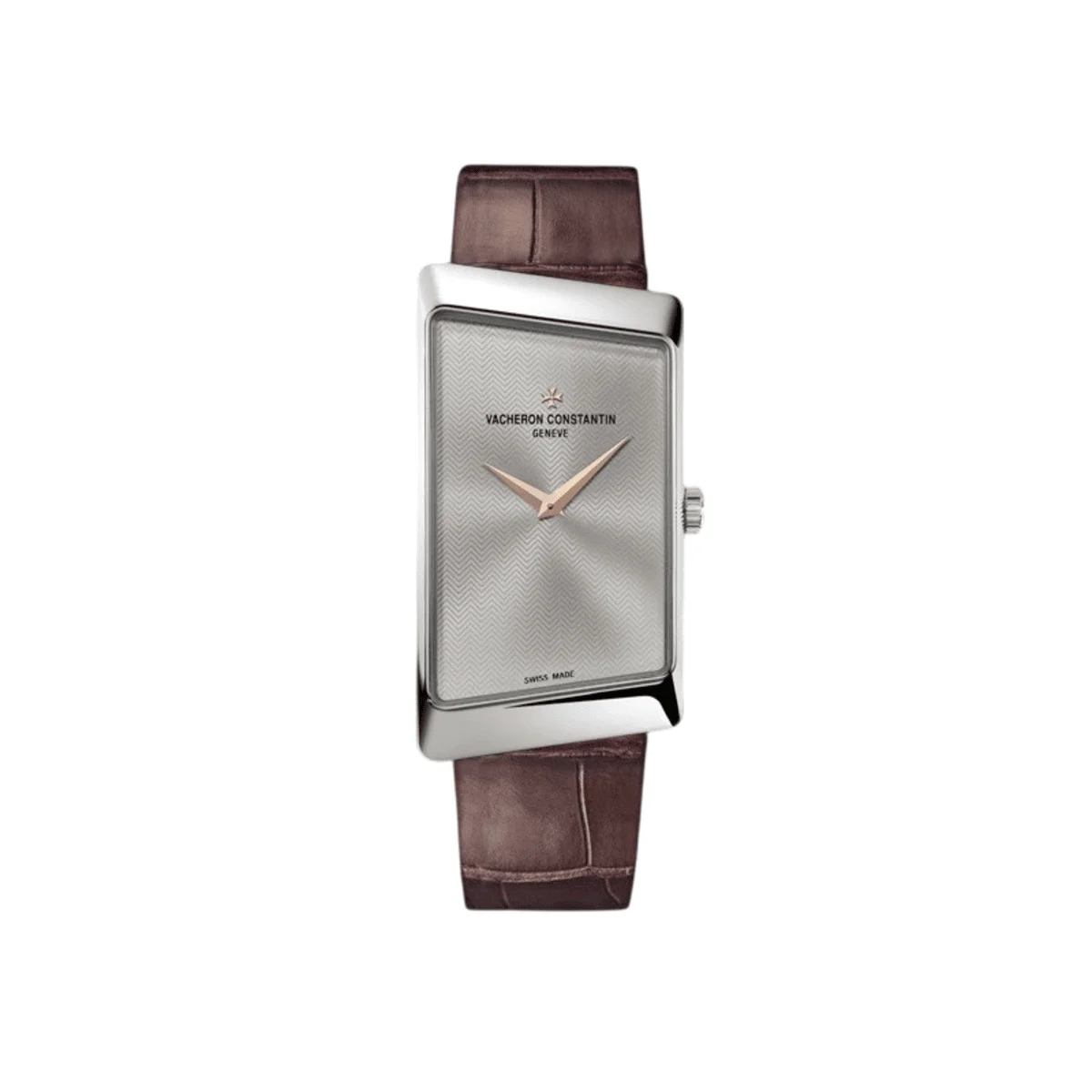 Vacheron Constantin 1972 Prestige 18Kt White Gold 25Mm X 50Mm Full frontal view of the Vacheron Constantin 1972 Prestige asymmetrical wristwatch with a white gold trapezoidal case and a dark brown alligator leather strap. The dial is silver with a sunburst chevron pattern, the brand name, and rose gold hour and minute hands.
